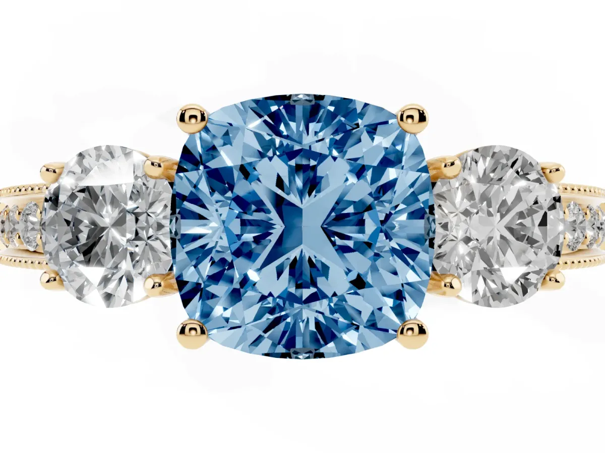 Fancy Blue Cushion Cut Three-Stone Diamond Ring with Pavé Band and Four-Prong Setting Yellow gold