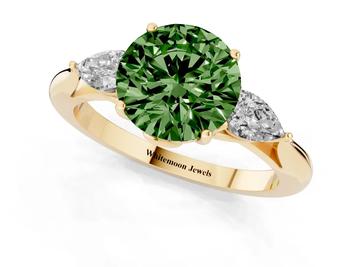 Fancy Green Three-Stone Round Cut Diamond Ring with Pear Side Stones in Four-Prong Setting Yellow gold