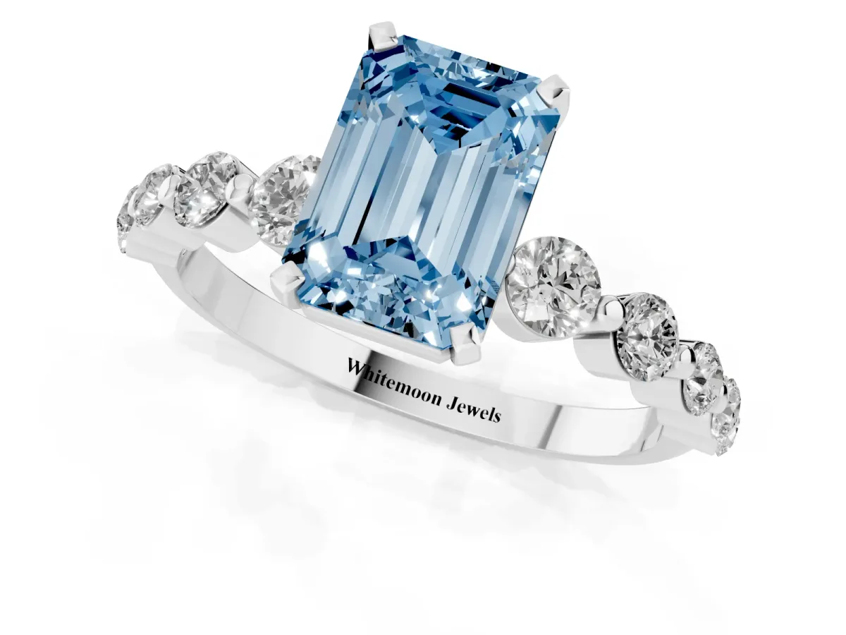 Fancy Blue Emerald Cut Solitaire Diamond Ring with Pave Band and Four-Prong Setting Silver