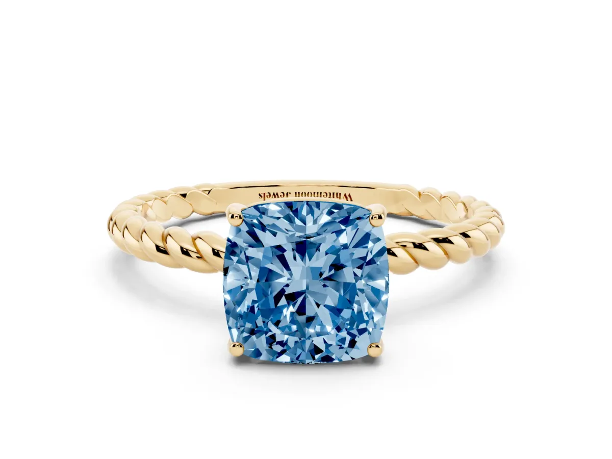 Fancy Blue Cushion Cut Solitaire Twist Band Ring with Four-Prong Setting Yellow gold