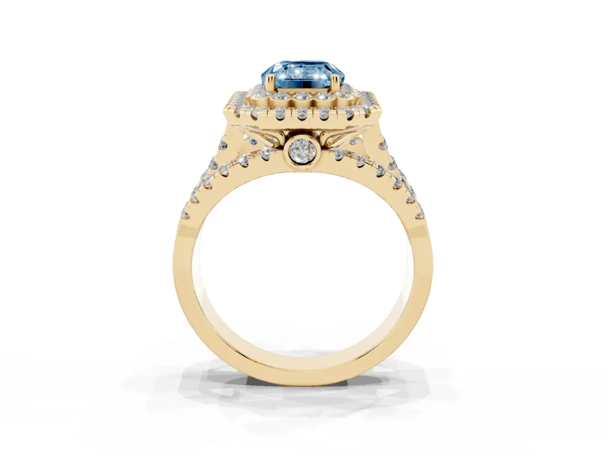 Fancy Blue Emerald Cut Diamond Double Halo Ring with Round Pavé Split Shank and Prong Setting Yellow gold