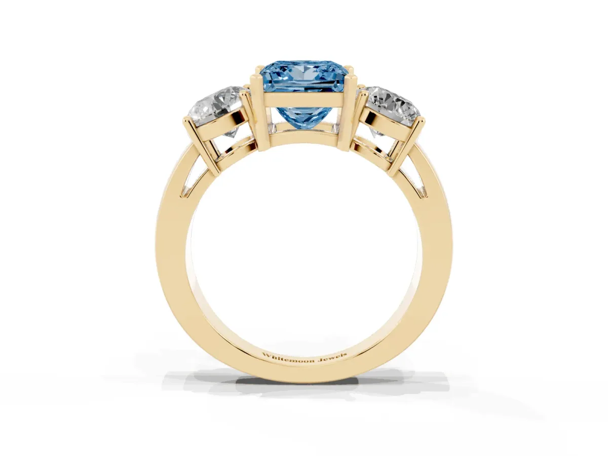 Fancy Blue Three-Stone Princess Cut Diamond Ring with Round Side Stones, Classic Band, and Four-Prong Setting Yellow gold