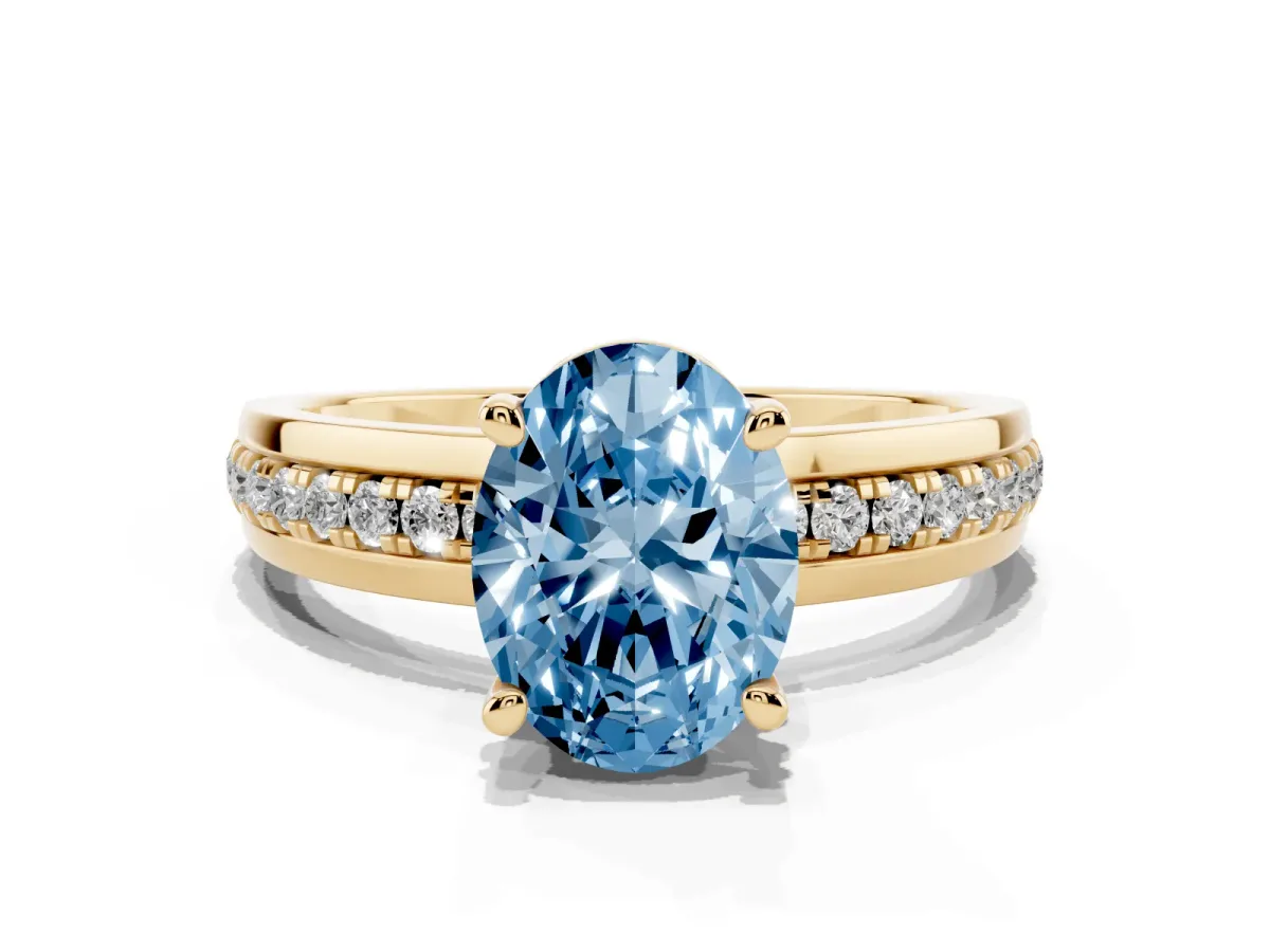 Fancy Blue Oval Cut Solitaire Diamond Ring with Channel Set Band and Six-Prong Setting Yellow gold