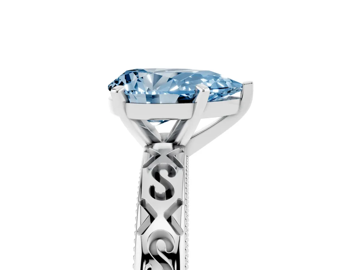 Fancy Blue Pear Cut Solitaire Engagement Ring with Scrollwork Band and Four-Prong Setting Silver