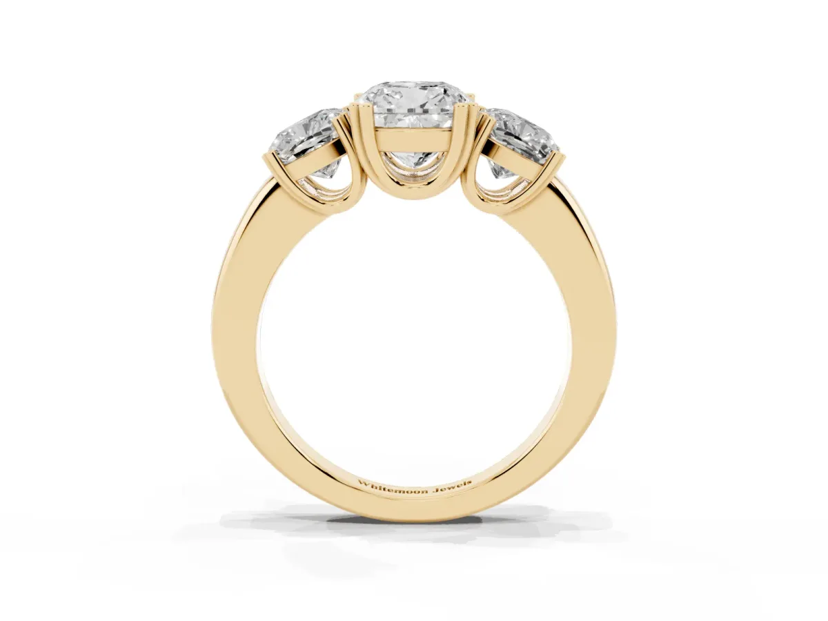 Three-Stone Cushion Cut Cut Diamond Ring with Channel Set Band and Four-Prong Setting Yellow gold