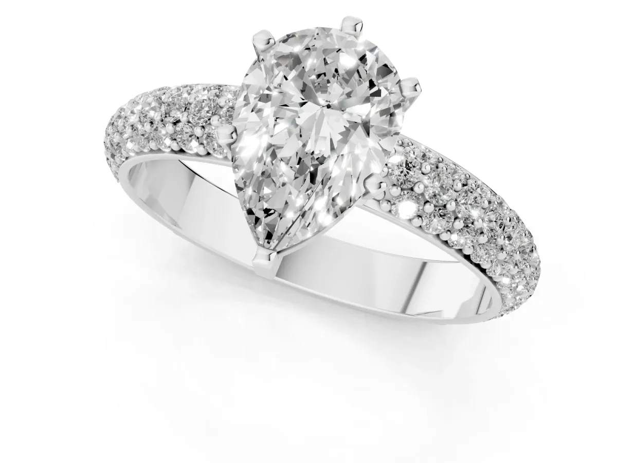 Pear Cut Diamond Solitaire Ring with Prong Setting and Pavé Band Platinum
