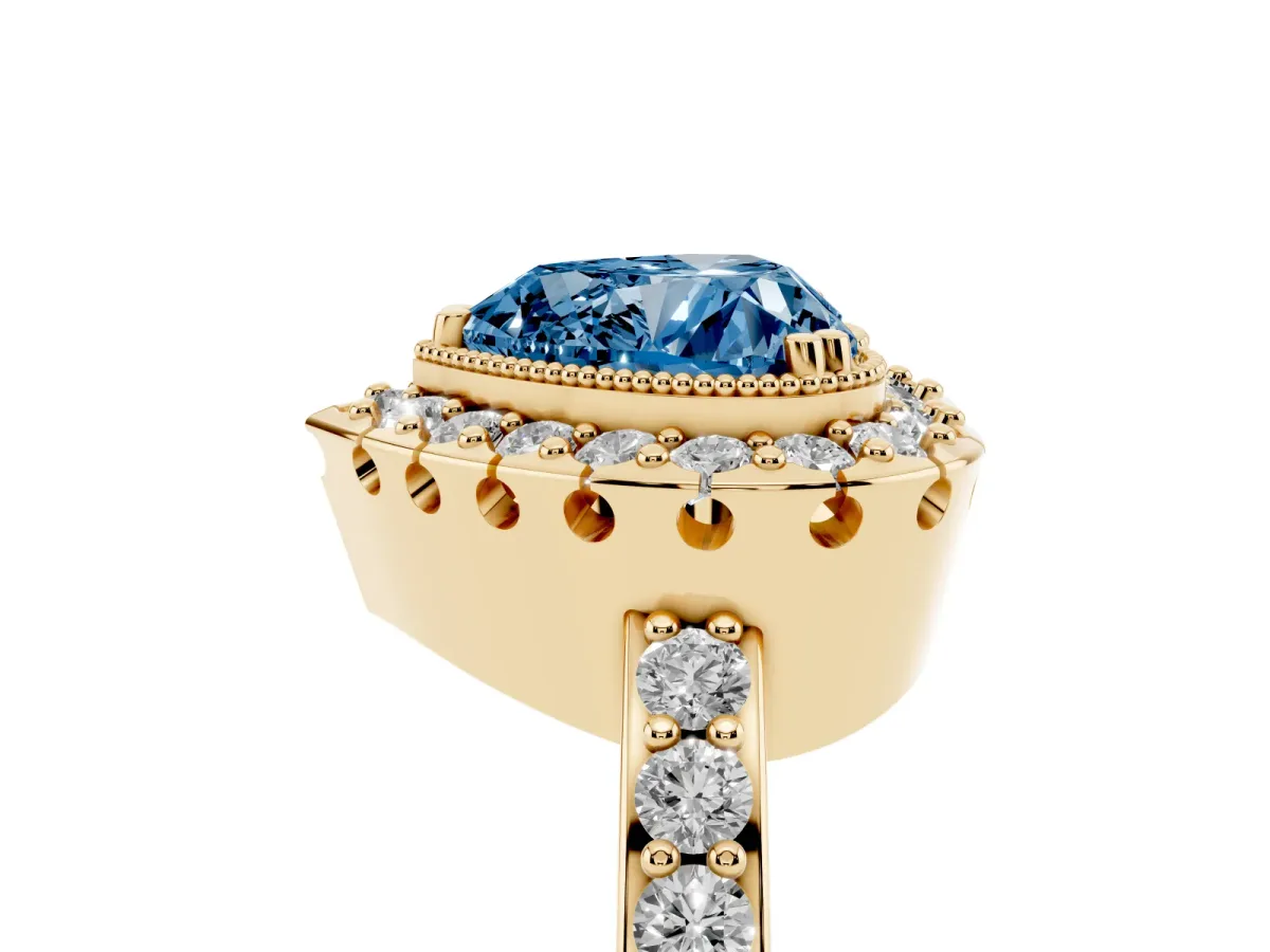 Fancy Blue Heart Cut Diamond Halo Ring with Pavé Band and Prong Setting Yellow gold