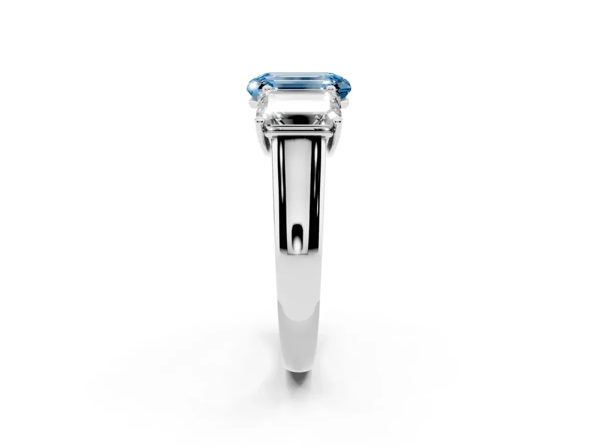 Fancy Blue Emerald Cut Three-Stone Diamond Ring with Prong Setting on a Classic Band Silver