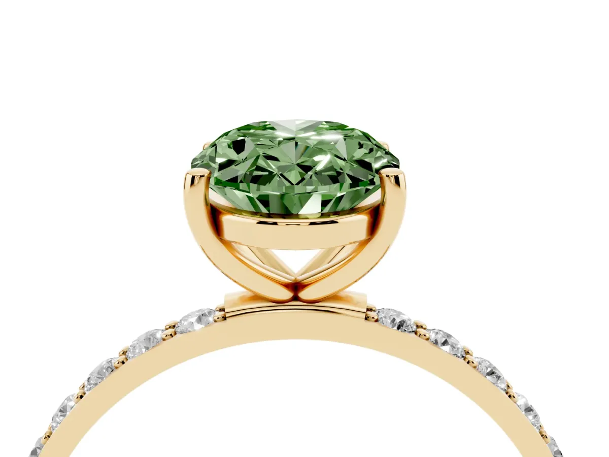 Fancy Green Oval Cut Diamond Solitaire Ring with Round Pavé Shoulders and Prong Setting Yellow gold