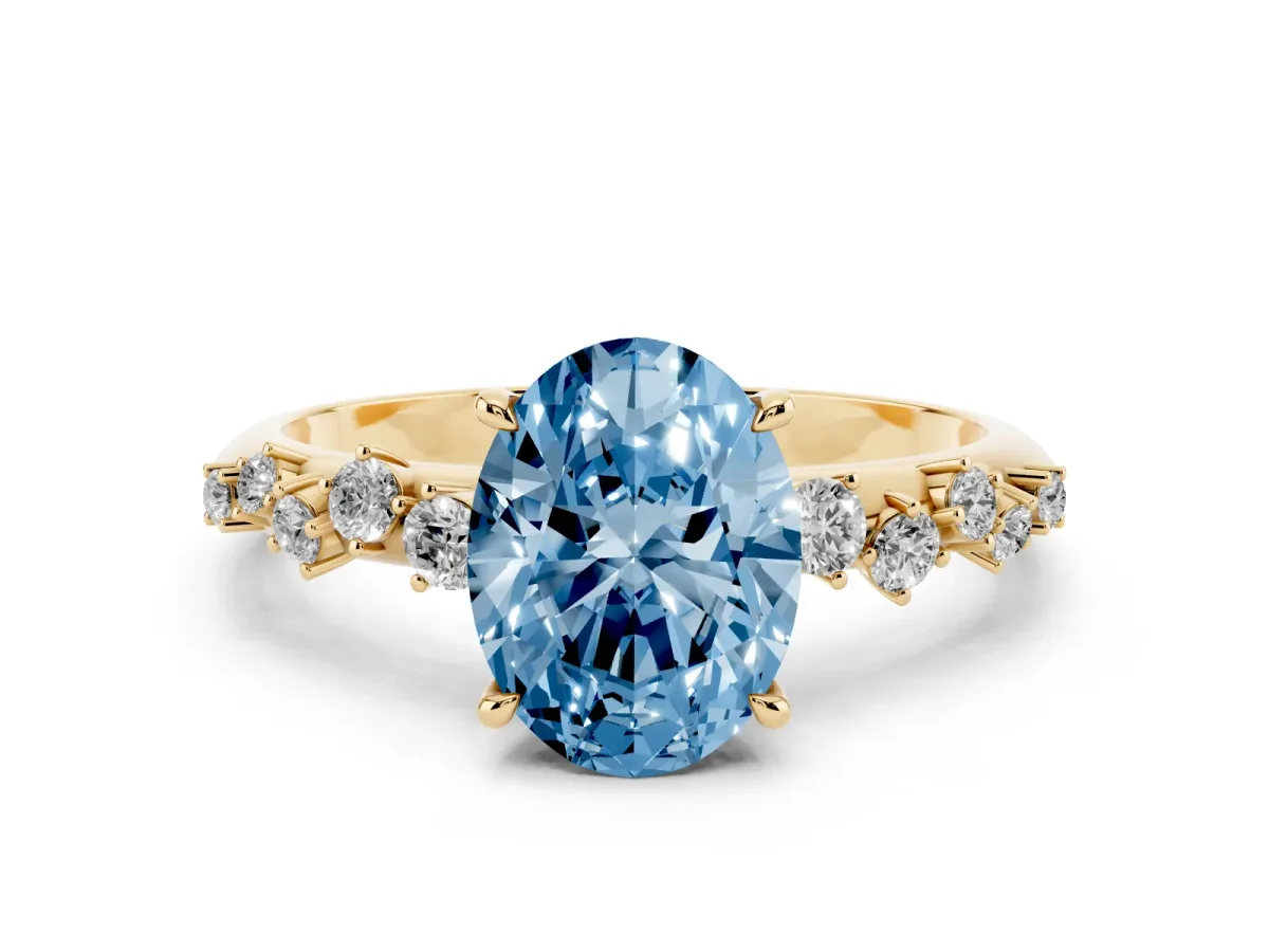 Fancy Blue Oval Cut Diamond Cluster Side Stone Solitaire Ring with Prong Setting Yellow gold