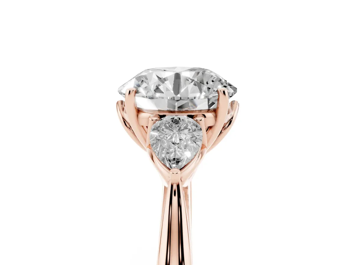 Three-Stone Round Cut Diamond Ring with Pear Side Stones in Four-Prong Setting Rose gold
