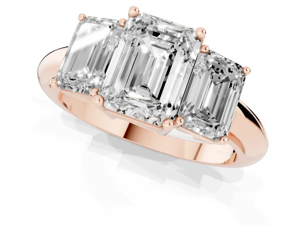 Three-Stone Emerald Cut Cut Diamond Engagement Ring with Prong Setting on a White Gold Band Rose gold