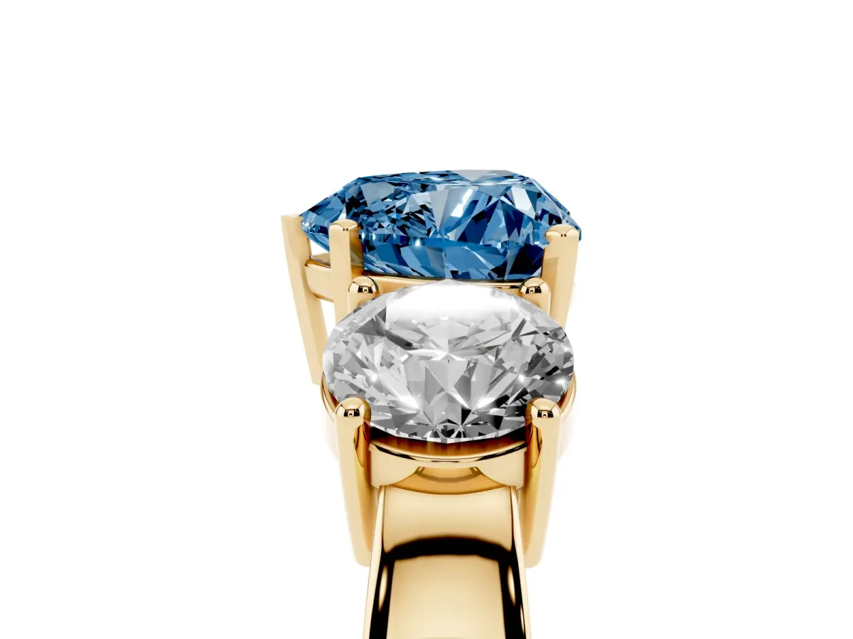 Fancy Blue Three-Stone Heart Cut Diamond Ring with Round Side Stones, Classic Band, and Four-Prong Setting Yellow gold