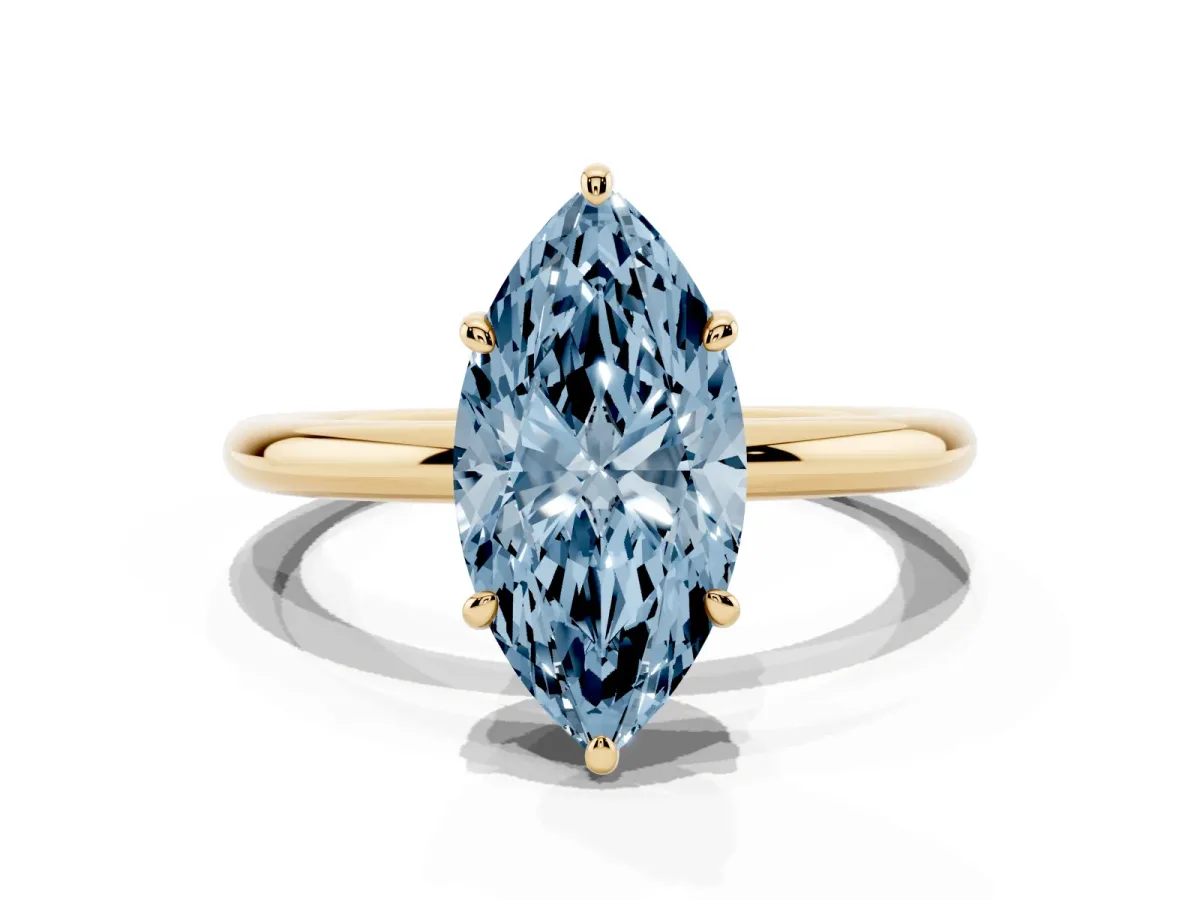Fancy Blue Oval Cut Solitaire Diamond Ring with Four-Prong Setting on a Plain Band Yellow gold