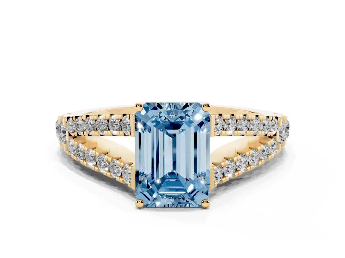 Fancy Blue Emerald Cut Diamond Split Shank Pavé Engagement Ring with Four-Prong Setting Yellow gold