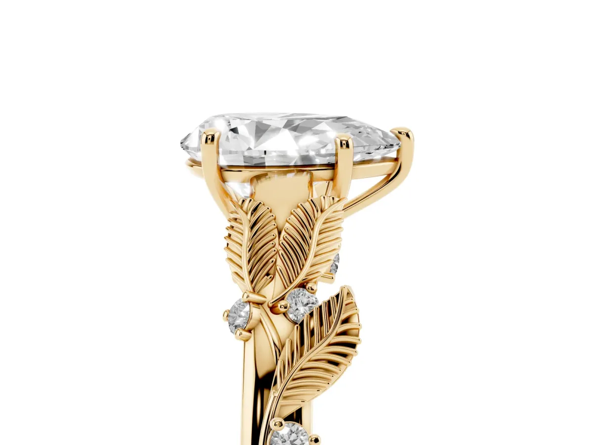 Pear Cut Diamond Solitaire Ring with Leaf Motif Band and Four-Prong Setting Yellow gold