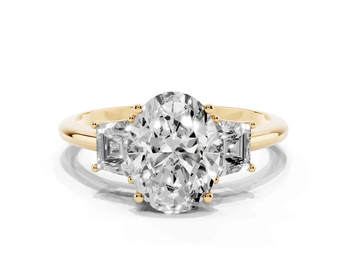 Oval Cut Diamond Three-Stone Ring with Trapezoid Side Stones and Prong Setting Yellow gold