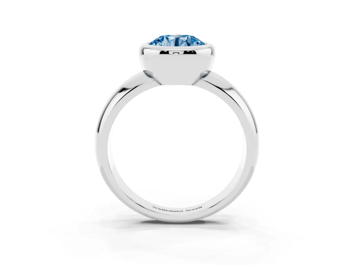 Fancy Blue Bezel Set Round Cut Solitaire Ring with Wide Band Platinum