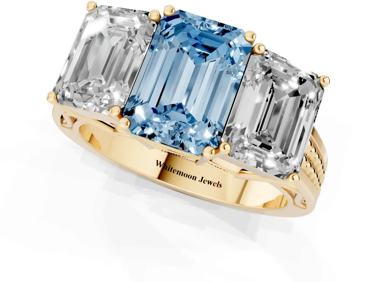 Fancy Blue Emerald Cut Diamond Three-Stone Ring with Prong Setting and Textured Band Yellow gold