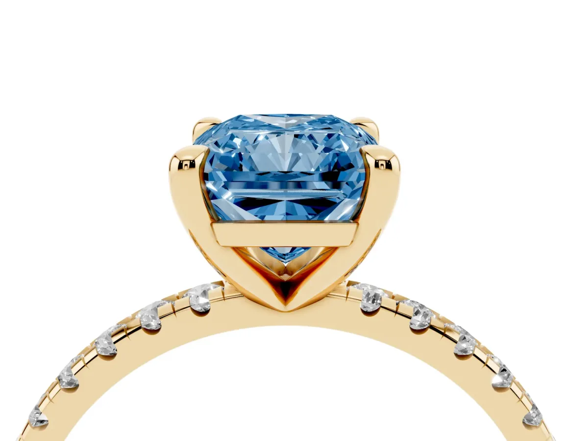 Fancy Blue Radiant Cut Diamond Brilliant Solitaire Ring with Pavé Band and Four-Prong Setting Yellow gold