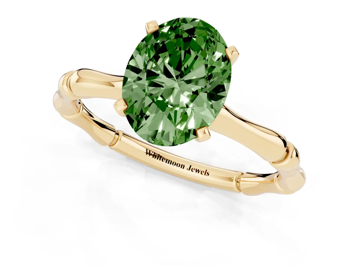 Fancy Green Oval Cut Solitaire Diamond Ring with Bamboo Band and Four-Prong Setting Yellow gold