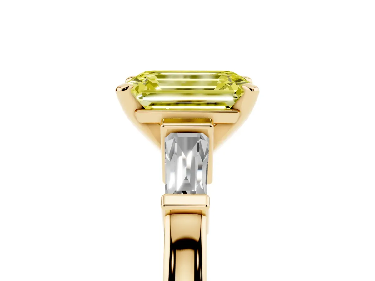 Fancy Yellow Emerald Cut Cut Diamond Solitaire Ring with Tapered Baguette Accents and Four-Prong Setting Yellow gold
