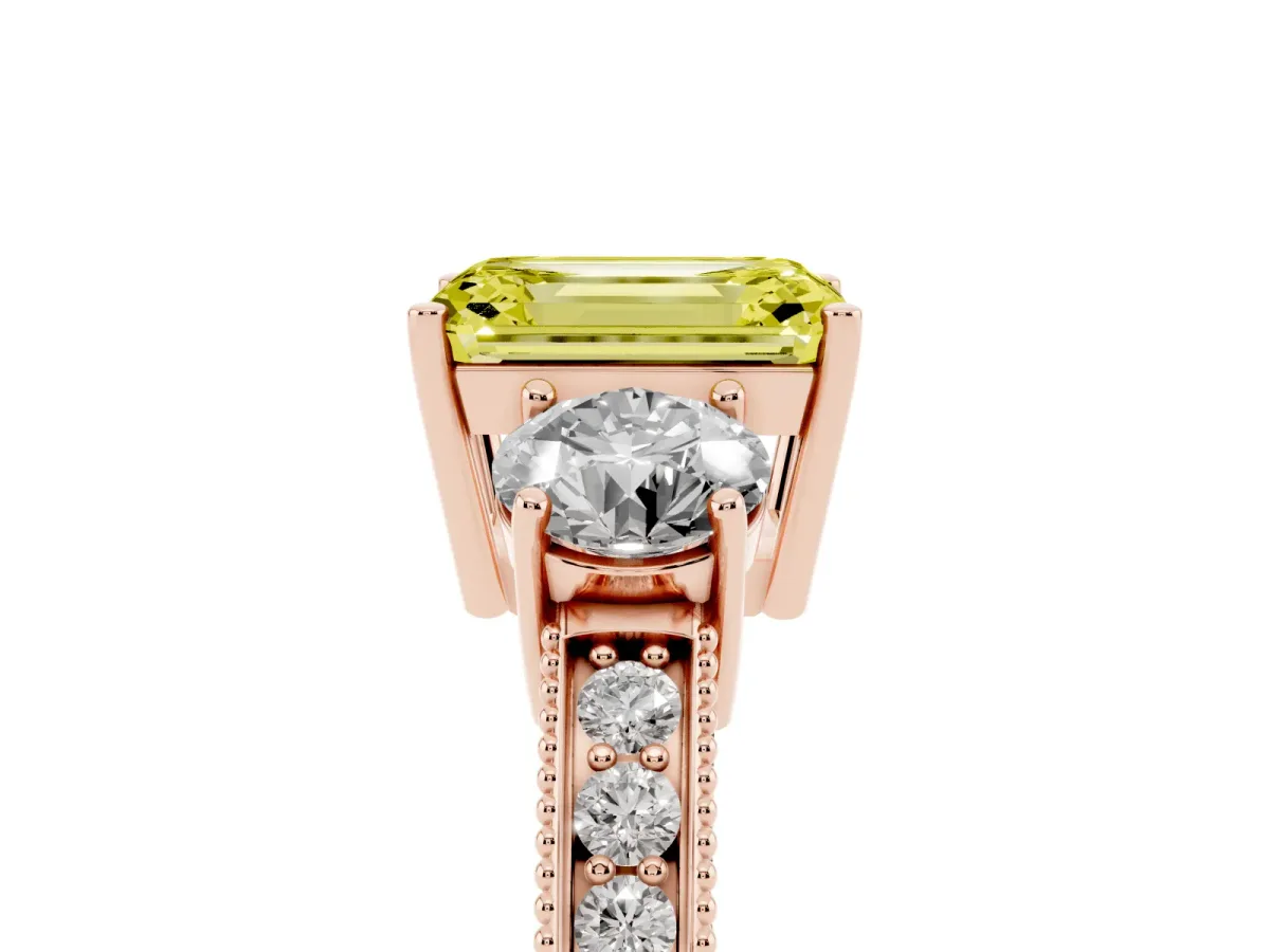 Fancy Yellow Emerald Cut Three-Stone Diamond Ring with Pavé Band and Four-Prong Setting Rose gold