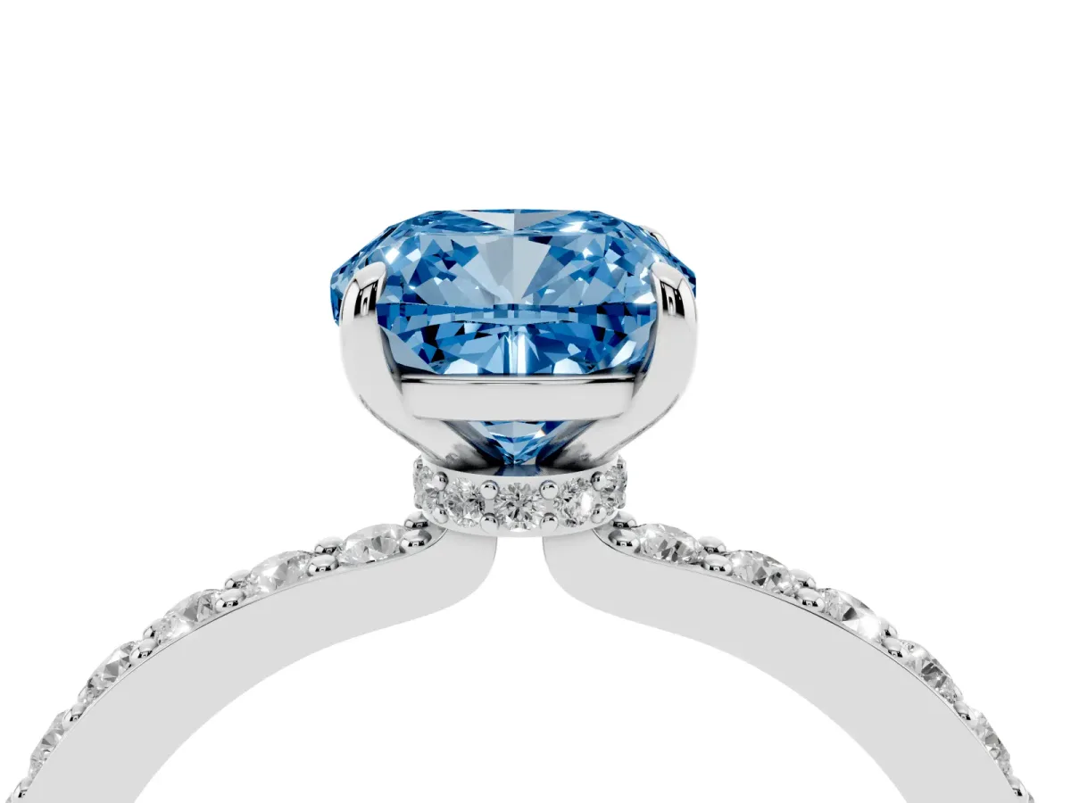 Fancy Blue Cushion Cut Diamond Solitaire Engagement Ring with Pavé Band and Four-Prong Setting Silver