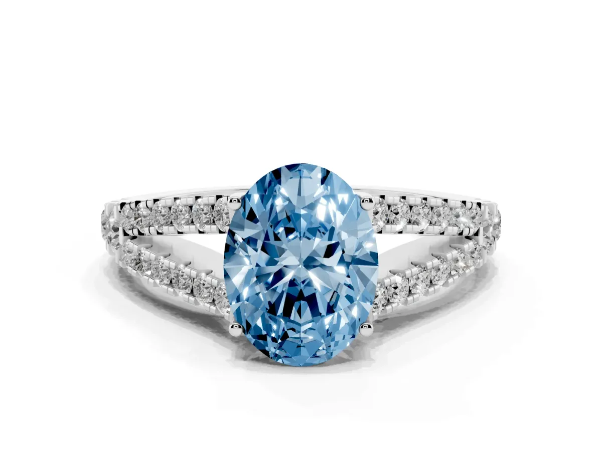 Fancy Blue Oval Cut Diamond Split Shank Pavé Engagement Ring with Four-Prong Setting Silver