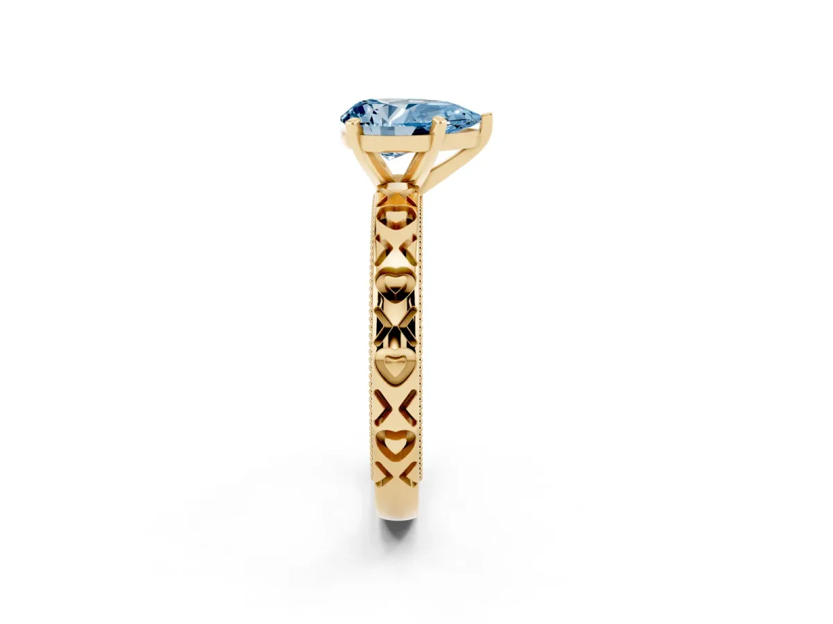 Fancy Blue Pear Cut Solitaire Diamond Engagement Ring with XO Engraved Band and Four-Prong Setting Yellow gold