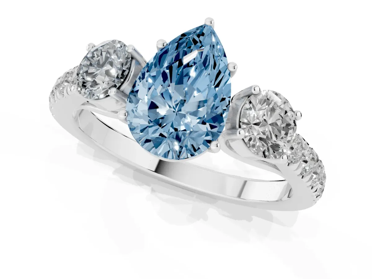 Fancy Blue Pear Cut Cut Diamond Three-Stone Ring with Round Side Stones and Pavé Band Silver