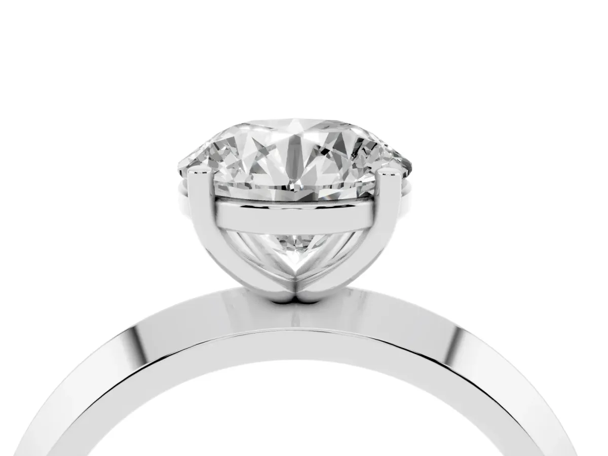 Round Cut Cut Solitaire Engagement Ring with Flat Band and Four-Prong Setting Silver