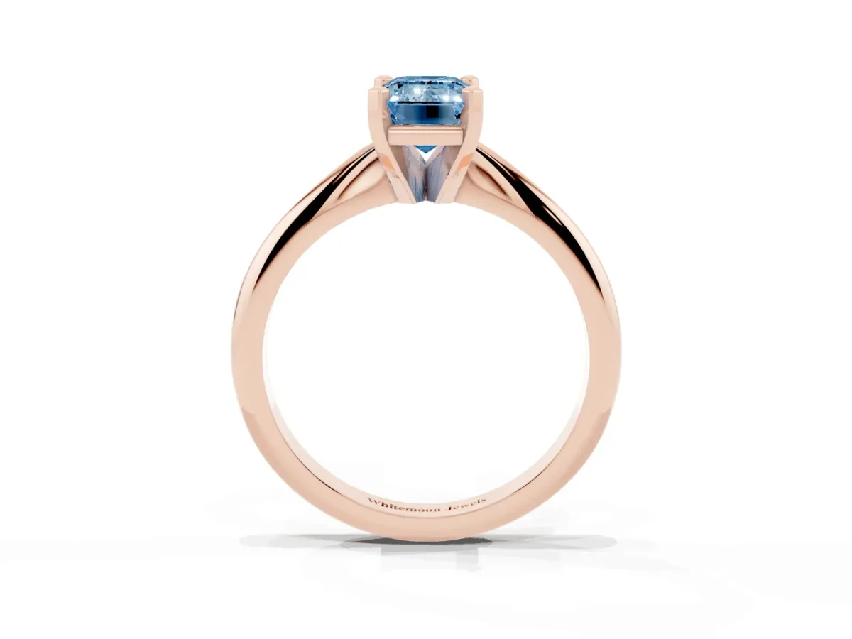 Fancy Blue Emerald Cut Cut Solitaire Ring with Four-Prong Setting on a Classic Band Rose gold