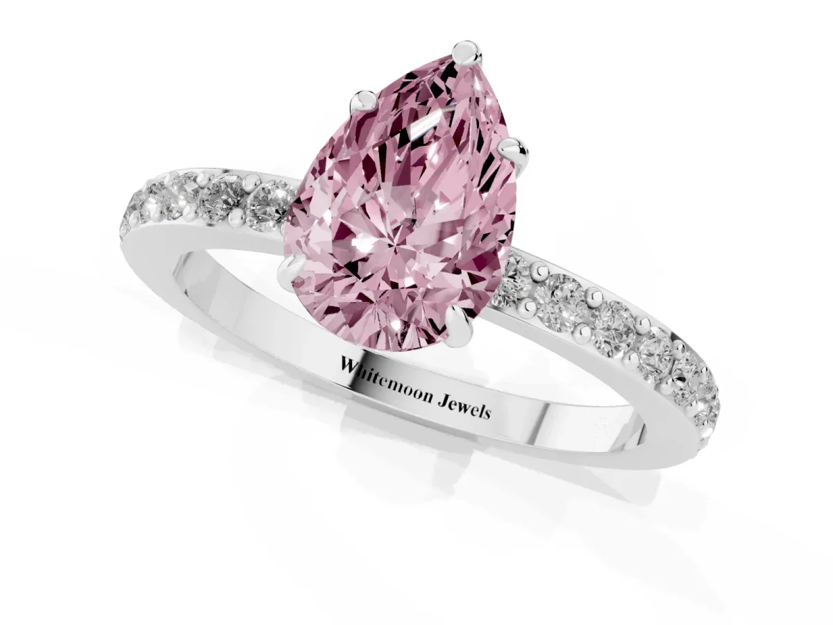 Fancy Pink Pear Cut Diamond Pavé Engagement Ring with Round Accents and Prong Setting Platinum