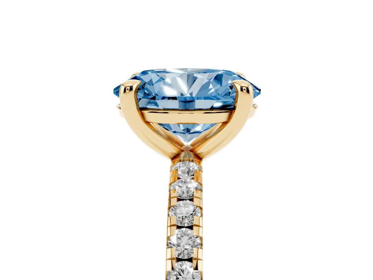 Fancy Blue Oval Cut Diamond Brilliant Solitaire Ring with Pavé Band and Four-Prong Setting Yellow gold