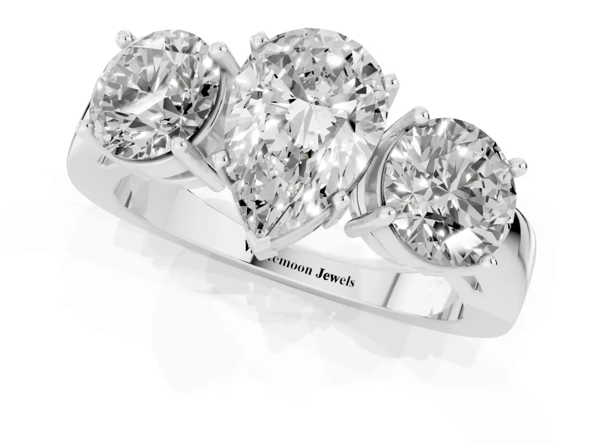 Three-Stone Pear Cut Diamond Ring with Round Side Stones, Classic Band, and Four-Prong Setting Platinum