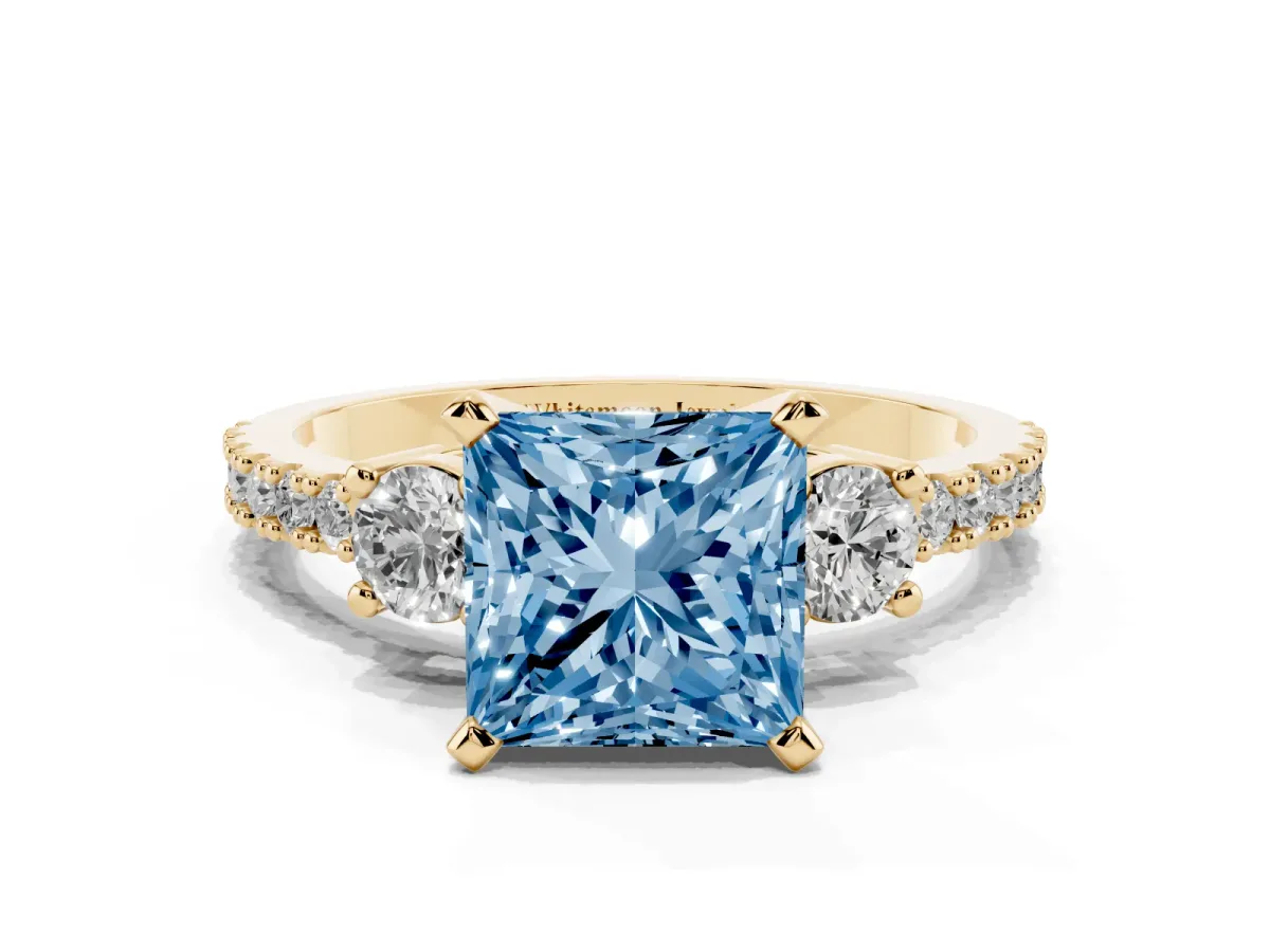 Fancy Blue Princess Cut Three-Stone Diamond Pavé Band with Prong Setting Yellow gold