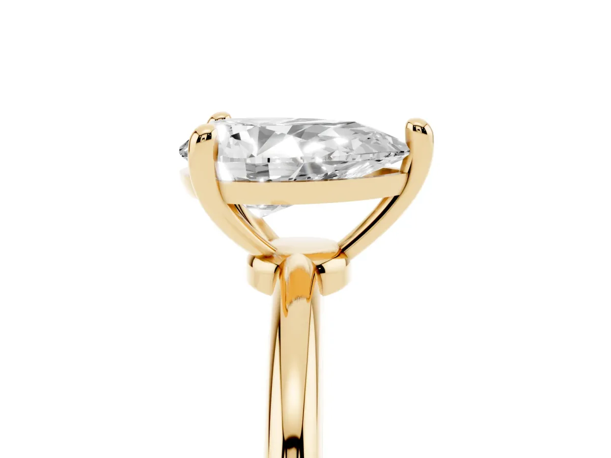 Pear Cut Solitaire Diamond Ring with 4-Prong Setting on a Classic Band Yellow gold