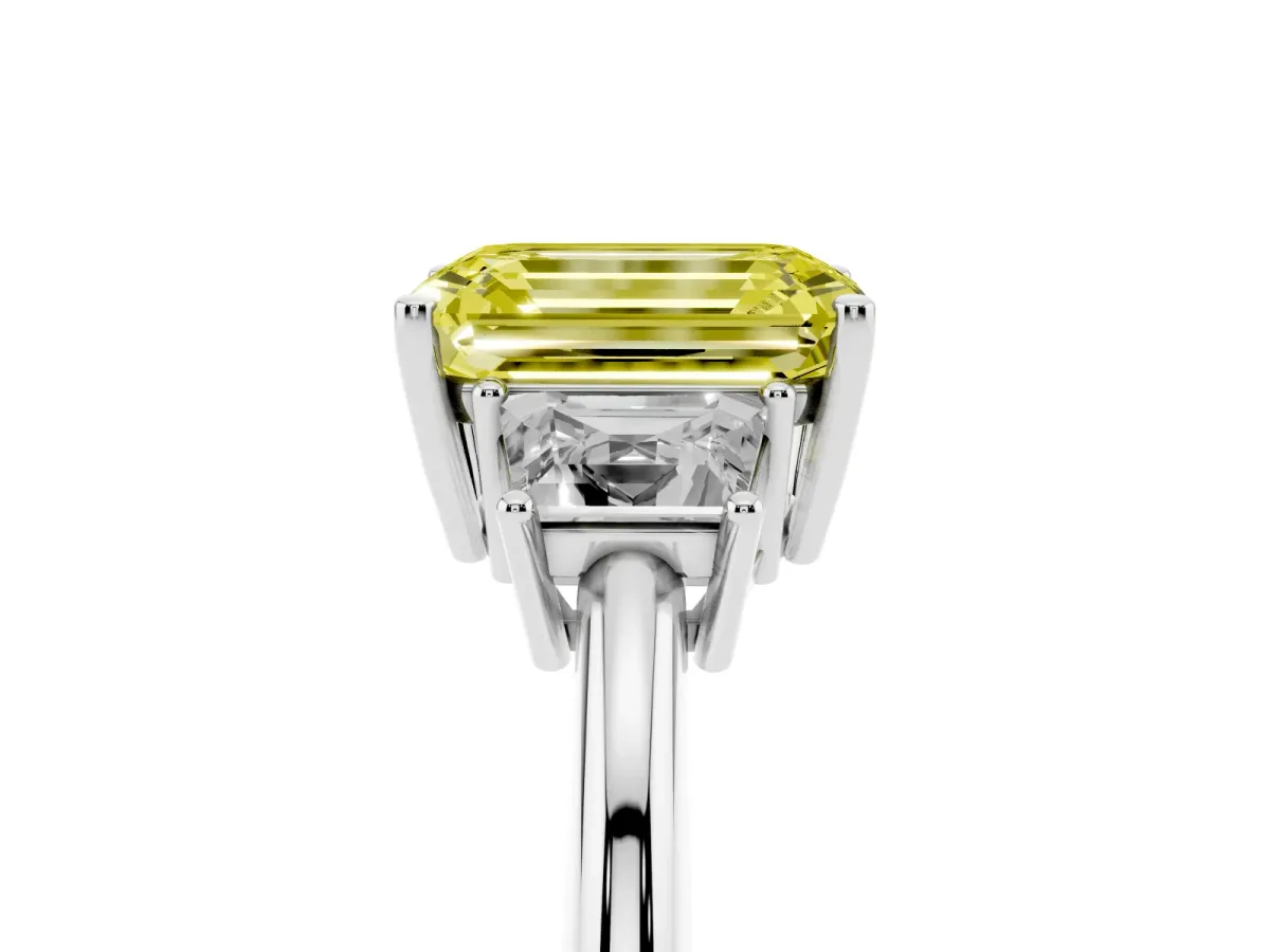 Fancy Yellow Emerald Cut Diamond Three-Stone Ring with Trapezoid Side Stones and Prong Setting Silver