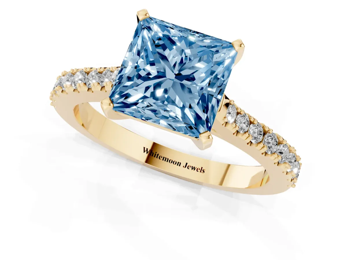 Fancy Blue Princess Cut Cut Solitaire Diamond Engagement Ring with Pave Band and Four-Prong Setting Yellow gold