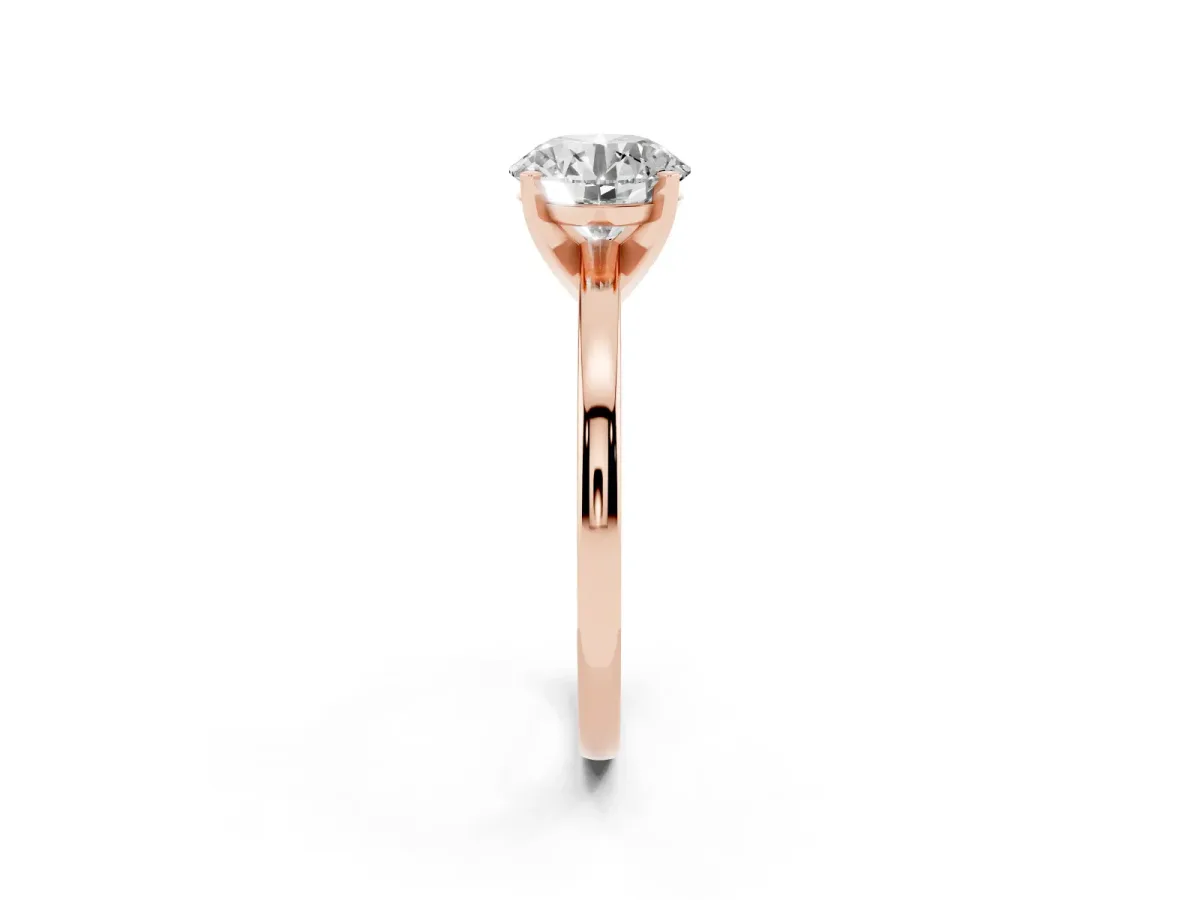Round Cut Solitaire Diamond Engagement Ring with Four-Prong Setting on a Classic Band Rose gold
