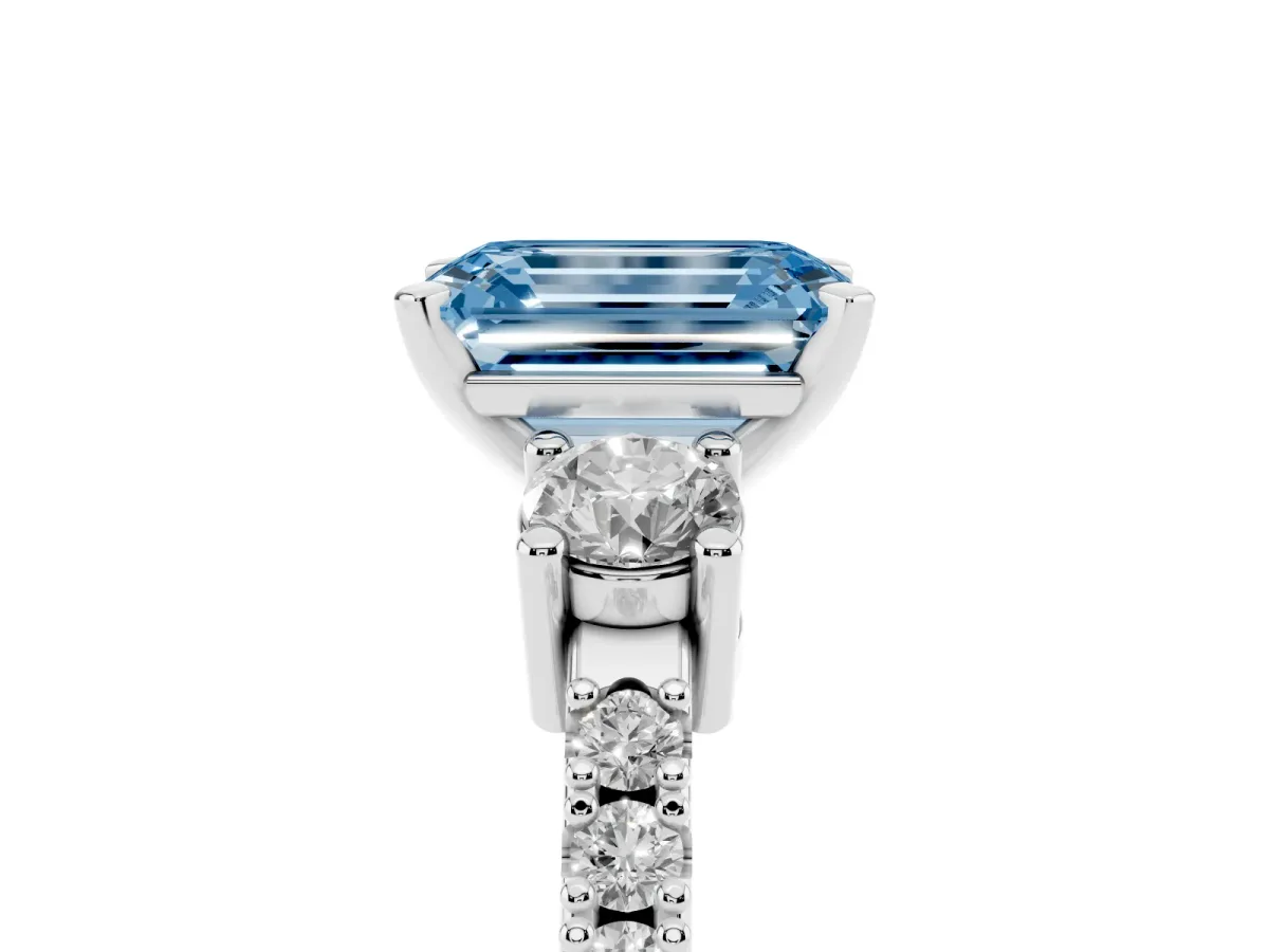 Fancy Blue Emerald Cut Three-Stone Diamond Pavé Band with Prong Setting Platinum