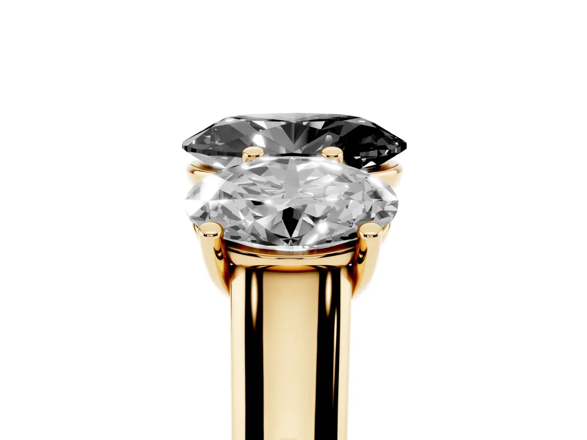 Fancy Black Oval Cut Three-Stone Diamond Ring with Prong Setting on a Classic Band Yellow gold