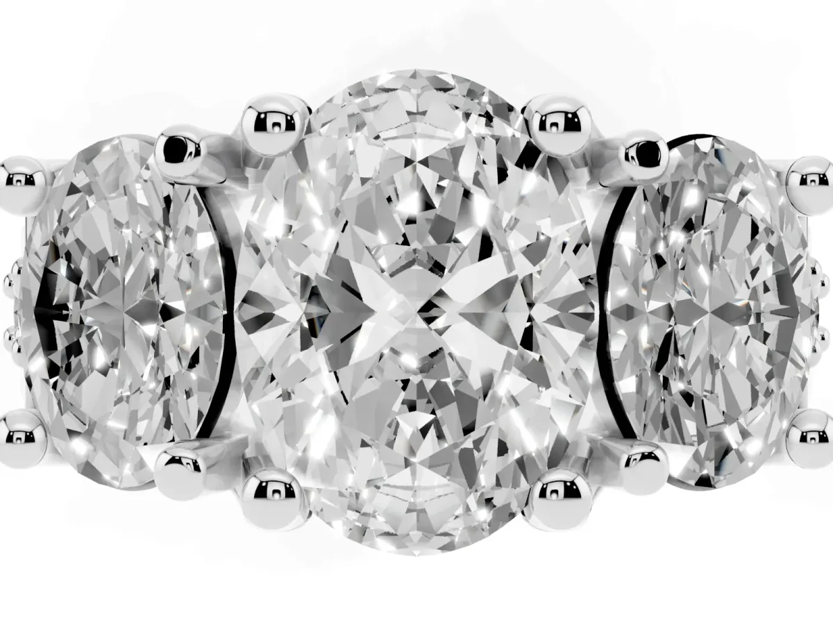 Oval Cut Diamond Three-Stone Ring with Channel Set Band and Four-Prong Setting Silver
