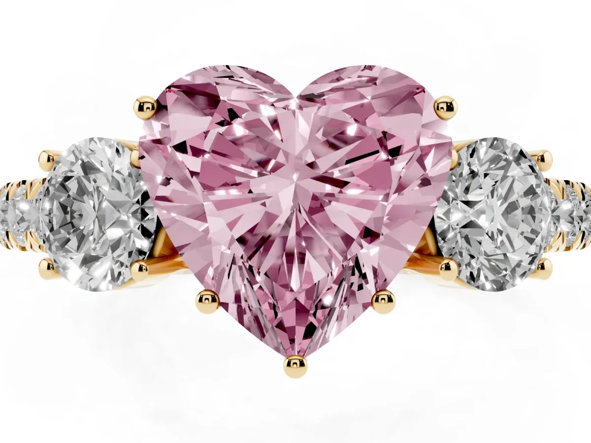 Fancy Pink Heart Cut Cut Diamond Three-Stone Ring with Round Side Stones and Pavé Band Yellow gold