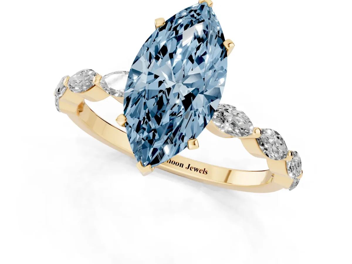 Fancy Blue Marquise Cut Diamond Ring with Marquise Side Stones and Prong Setting Yellow gold