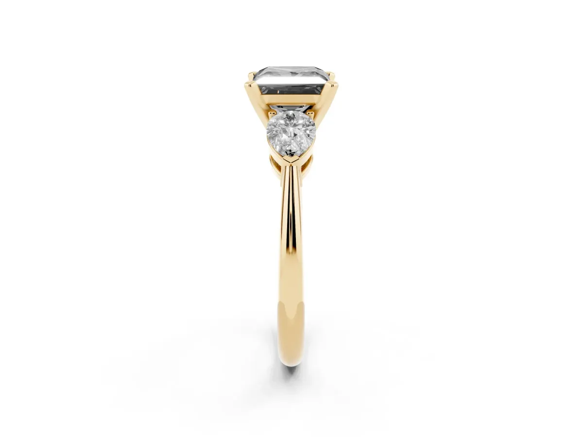Fancy Black Three-Stone Princess Cut Diamond Ring with Pear Side Stones and Four-Prong Setting Yellow gold