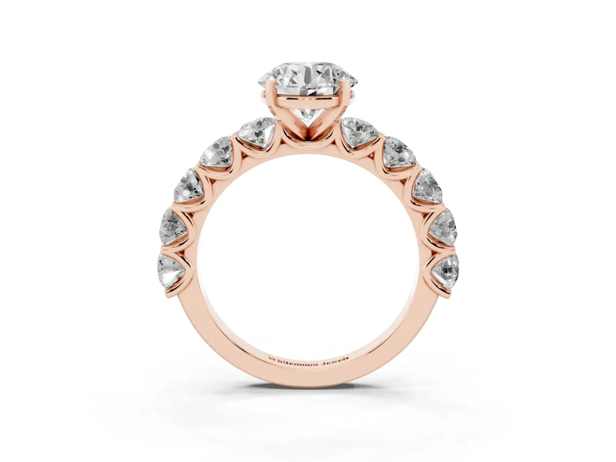Round Cut Diamond Prong Setting with Side Stones on a Pave Band Rose gold