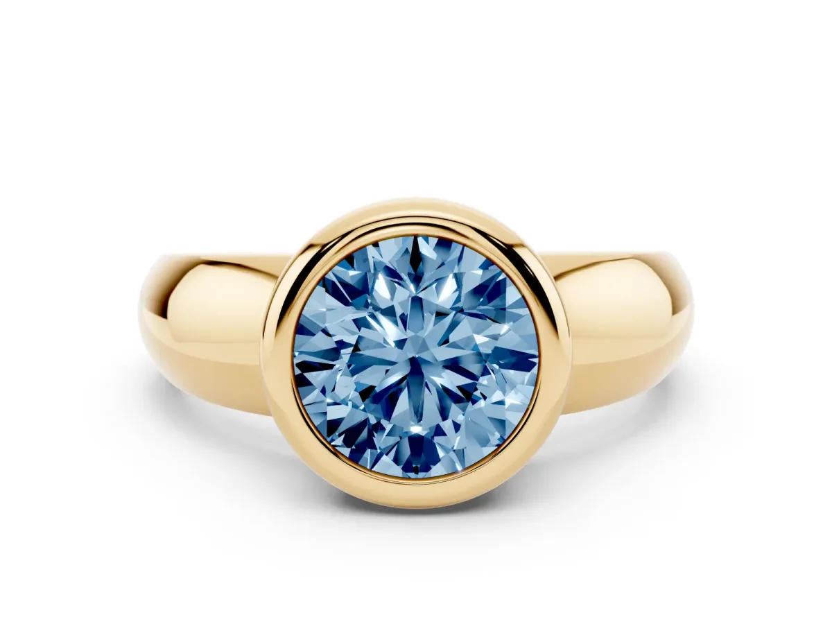 Fancy Blue Bezel Set Round Cut Solitaire Ring with Wide Band Yellow gold