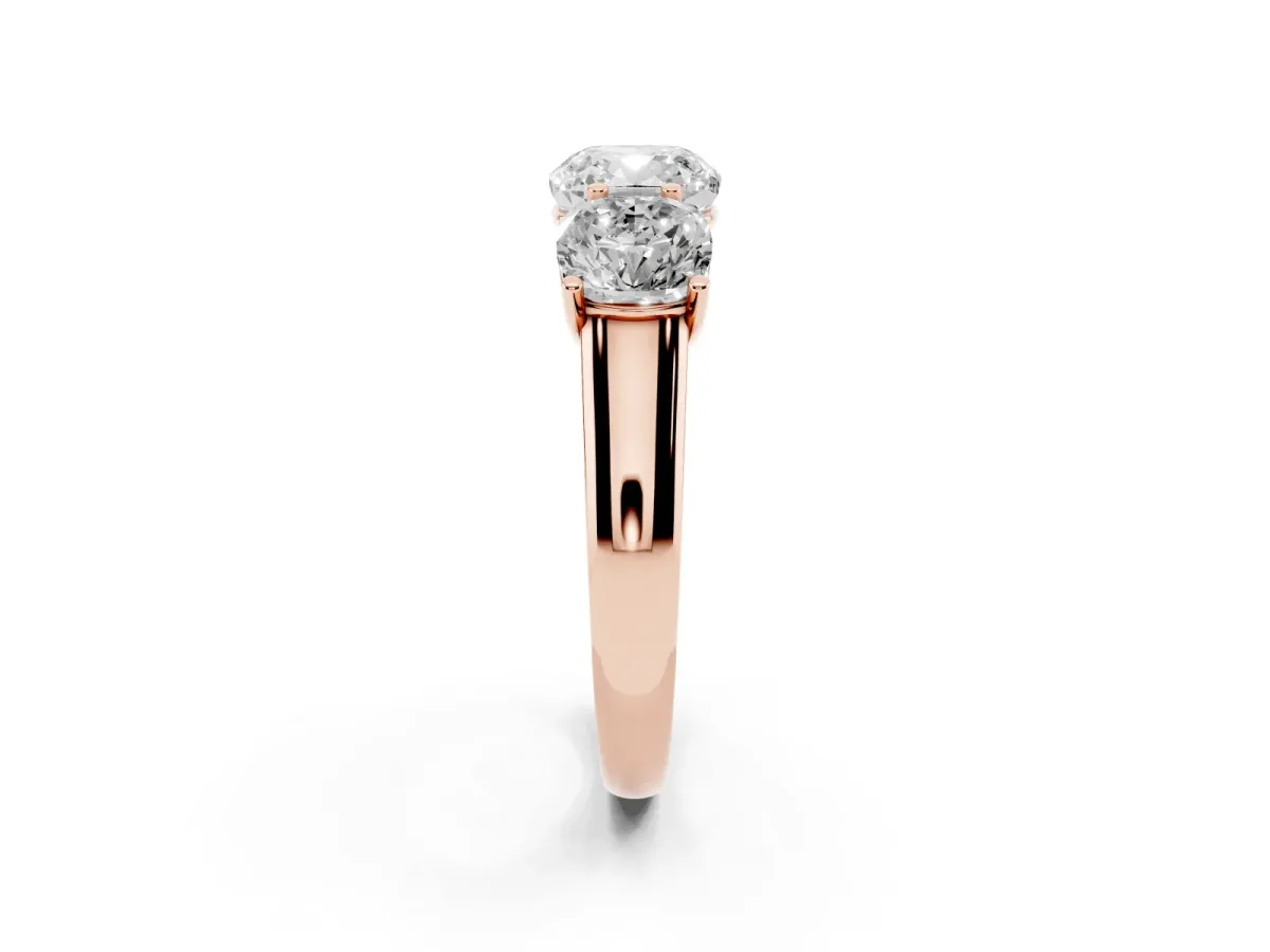 Cushion Cut Three-Stone Diamond Ring with Prong Setting on a Classic Band Rose gold